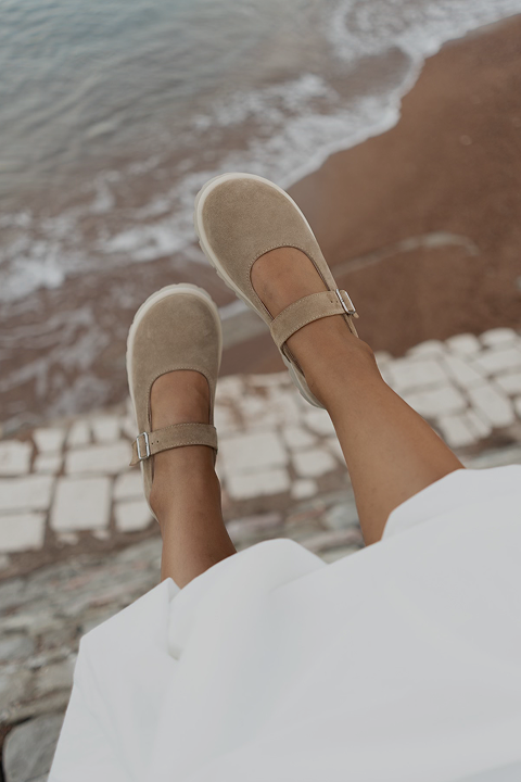 Chocolate loafers on the legs