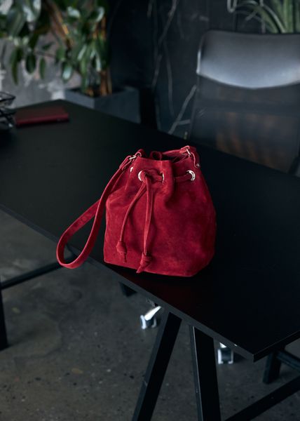 Red suede pouch bag